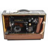 A Vintage Cased Electric Singer Sewing Machine, with Instructions but Untested