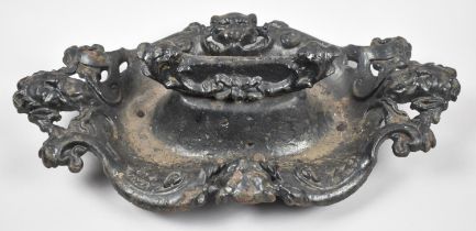 A Heavy Cast Metal Boot Scraper Decorated with Devil Masks and Panther Heads in Relief, 47cm Long