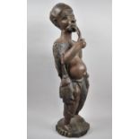 A Large Carved African Figure of Pot Bellied Gent Smoking Pipe, 59cm high