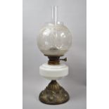 A Late Victorian Brass Based Oil Lamp with Opaque Glass Reservoir and Etched Globe, Duplex Controls,