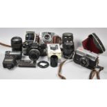 A Small Collection of Vintage Cameras, Lenses and Photographic Accessories