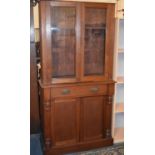 A Late Victorian/Edwardian Library Bookcase with Centre Drawer Over Cupboard Base, Raised Shelved