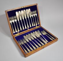 An Early 20th Century Oak Cased Canteen of Twelve Silver Plated Fish Knives and Forks