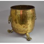 A Large Brass Coal Bucket having Lion Mask Handles and Claw Feet with Banded Bottom
