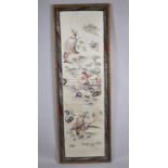 A Large Oriental Silk Embroidery Depicting Figures, Pagodas and Trees, 41x129cm