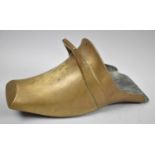 A Single Brass Indo-Persian Stirrup in the Form a Shoe, 26cm Long