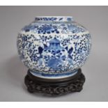 A 19th Century Chinese Blue and White Vase of Squat Bellied Form Decorated with Precious Objects,