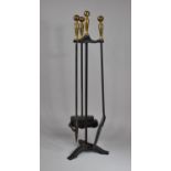 An Iron and Brass Handled Fire Companion Set to comprise Brush, Poker and Shovel