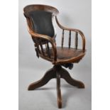 An Early 20th Century Oak Framed Swivel Office Armchair with Studded Pad Seat and Back