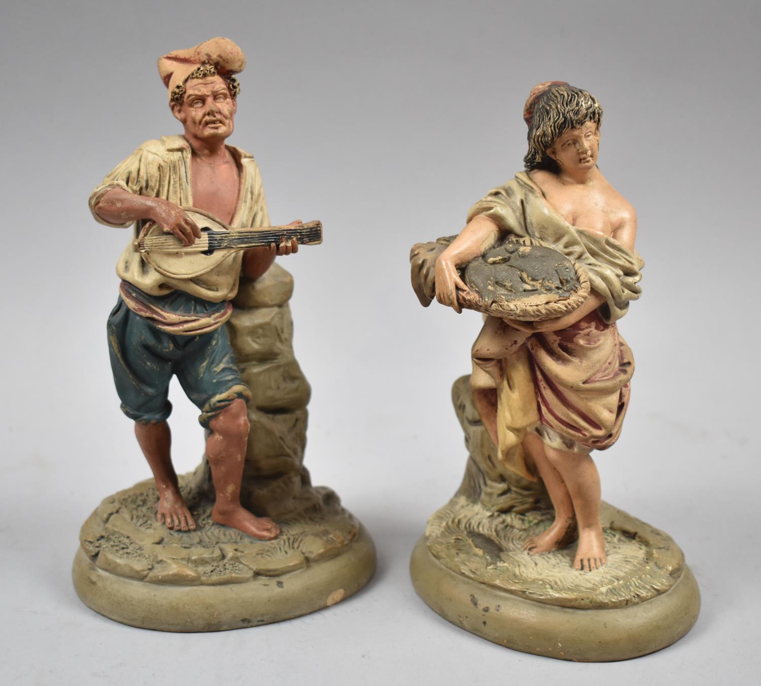 A Pair of Cold Painted German Terracotta Figures of Fisherman Playing Mandolin and Wife of Basket of