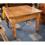 A Late 19th/Early 20th Century Draw Leaf Dining Table on Turned Supports Culminating in Casters,