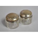 A Pair of Small Glass and Silver Topped Dressing Table Pots