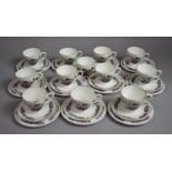 An Indian Tree Tea Set to Comprise Twelve Cups, Eleven Saucers and Eleven Side Plates