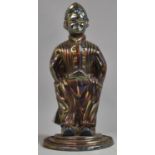 A Novelty Enamelled Cast Metal Fire Companion Set in the form of a Seated Dutch Boy Wearing Clogs,