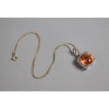 A Silver and Tangerine Glass Pendant Surrounded by Halo of CZs. 2cms Wide