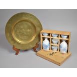 A Modern Boxed Japanese Sake Set Together with a Chinese Brass Charger with Engraved Decoration