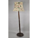 A Mid 20th Century Oak Standard Lamp with Shade