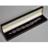 A Cased Silver, Garnet and Marcasite Sectional Bracelet, 20cms Long.