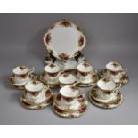 A Royal Albert Tea Set to comprise Eight Cups, Seven Saucers, Seven Side Plates, and Two Cake Plates