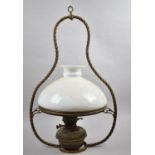 A Late/Early 20th Century Ceiling Hanging Oil Lamp with Opaque Glass Shade