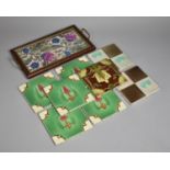 A Collection of Various Victorian and Edwardian Decorated Glazed Tiles Together with a Tile Based