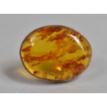 A Silver and Amber Oval Brooch 3x2.4cms