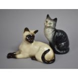 A Beswick Seated Cat and a Royal Doulton Reclining Persian Cat