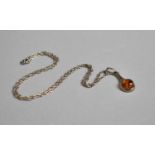 A Silver and Amber Pendant on Chain, Pendant Drop 2.5cms