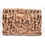 A Far Eastern Intricately Carved Wooden Panel Depicting Figures Harvesting, 50x33cm