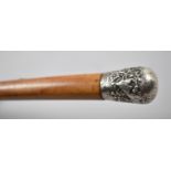 An Early 20th Century Malacca Walking Cane with Continental Silver Top Decorated in Relief with