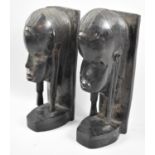 A Pair of Carved African Souvenir Bookends in the form of Masai Warrior Masks, 23cm High