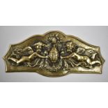 A 19th Century Brass Relief Moulded Plate Depicting Winged Cherub with Vase, 19.5cm Wide