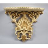 A Mid 20th Century Cream and Gilt Wall Sconce Shelf with Shell Decoration, 36cm Wide