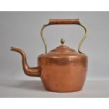 A Brass Mounted Copper Kettle, 29cm high