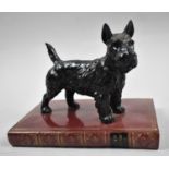 A Modern Cast Resin Study of Yorkshire Terrier, Standing on Book by Chaucer, 16.5cm Long