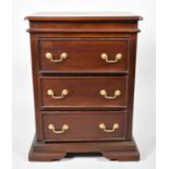 A Modern Mahogany Three Drawer Chest with Brass Drop Handles, 56cm Wide