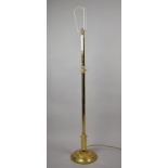 A Mid 20th Century Brass Standard Lamp with Hexagonal Support on Circular Base