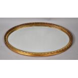 A Mid 20th Century Gilt Framed Oval Wall Mirror, 74x47cm Overall