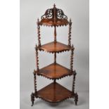 A Late Victorian Four Tier Corner Whatnot with Shaped Shelves, Barley Twist Supports and Scrolled