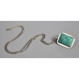 A Rectangular Silver Mounted Turquoise Pendant on Silver Chain
