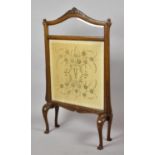 An Edwardian Mahogany Framed Firescreen with Silk Embroidered Panel Depicting Flowers and