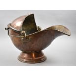 A Copper Helmet Shaped Coal Scuttle, 40cm wide