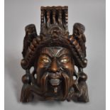 A Carved Far Eastern Wooden Study of a God, 15cm high