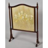 An Edwardian Mahogany Framed Fire Screen with Silk Embroidered Panel Depicting Basket of Flowers,