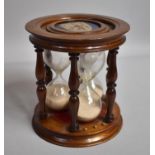 A Reproduction Mahogany Cylindrical Three Hourglass Egg Timer Allowing to Time Three, Four or Five