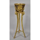 An Early 20th Century French Gilt Stand with a Wicker Jardiniere Decorated with Gilt Cherubs