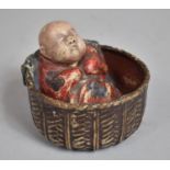 A 19th Century Chinese Carved Wood Figure of a Sleeping Baby in a Wicker Basket with Original