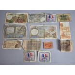 A Collection of Various Foreign Bank Notes to include French and Spanish Examples Etc