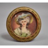 A Framed Circular Continental Miniature Portrait of a Maiden with Bonnet, 6.5cm diameter