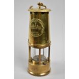 A Brass Miner's Safety Lamp by the Protector Lamp & Lighting Company, 25cm high